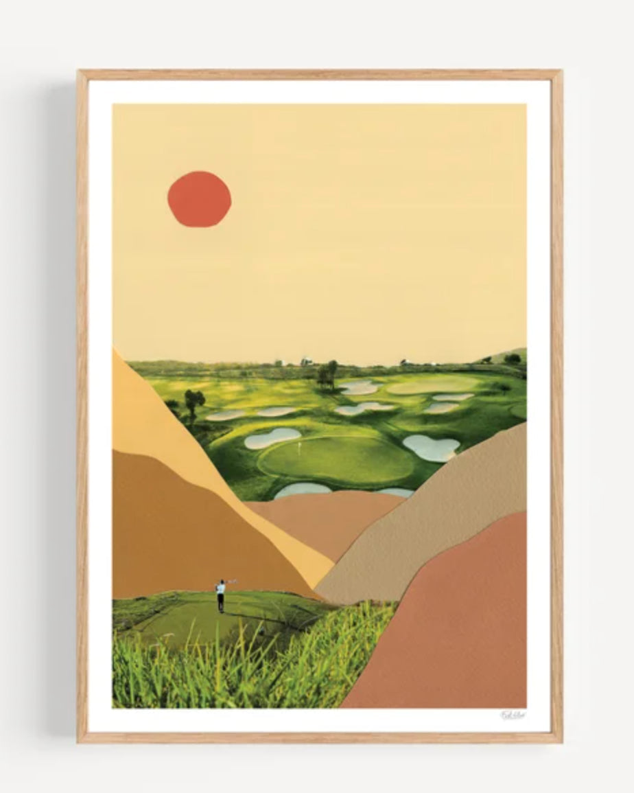 Framed artwork of a stylized landscape with green fields, a red sun, and a person walking.